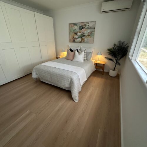 Blonde Oak 12094 pale cream laminate flooring installed in modern room