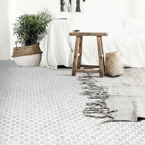 Carrara marble penny mosaic tile closeup circular pattern white grey veining