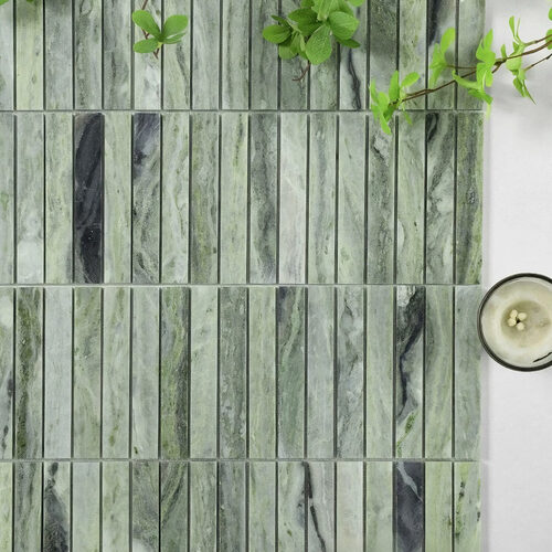 Cloudy green marble kitkat mosaic tile closeup swirling green tones indoor