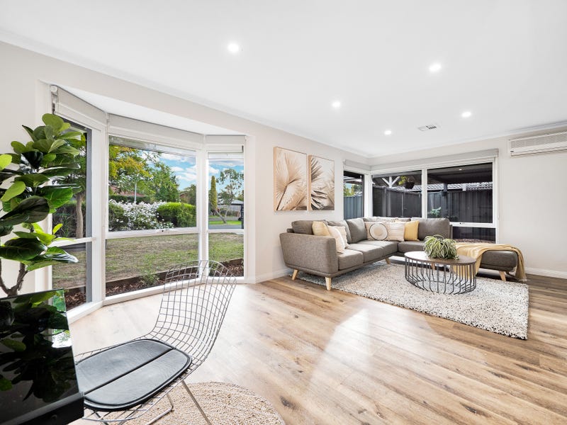 Natural Wild Oak hybrid flooring wide-plank installation with Castle Moat darker grain accents