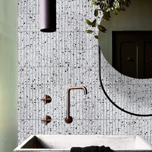 Grey terrazzo kitkat mosaic tile installation shower niche cement tones