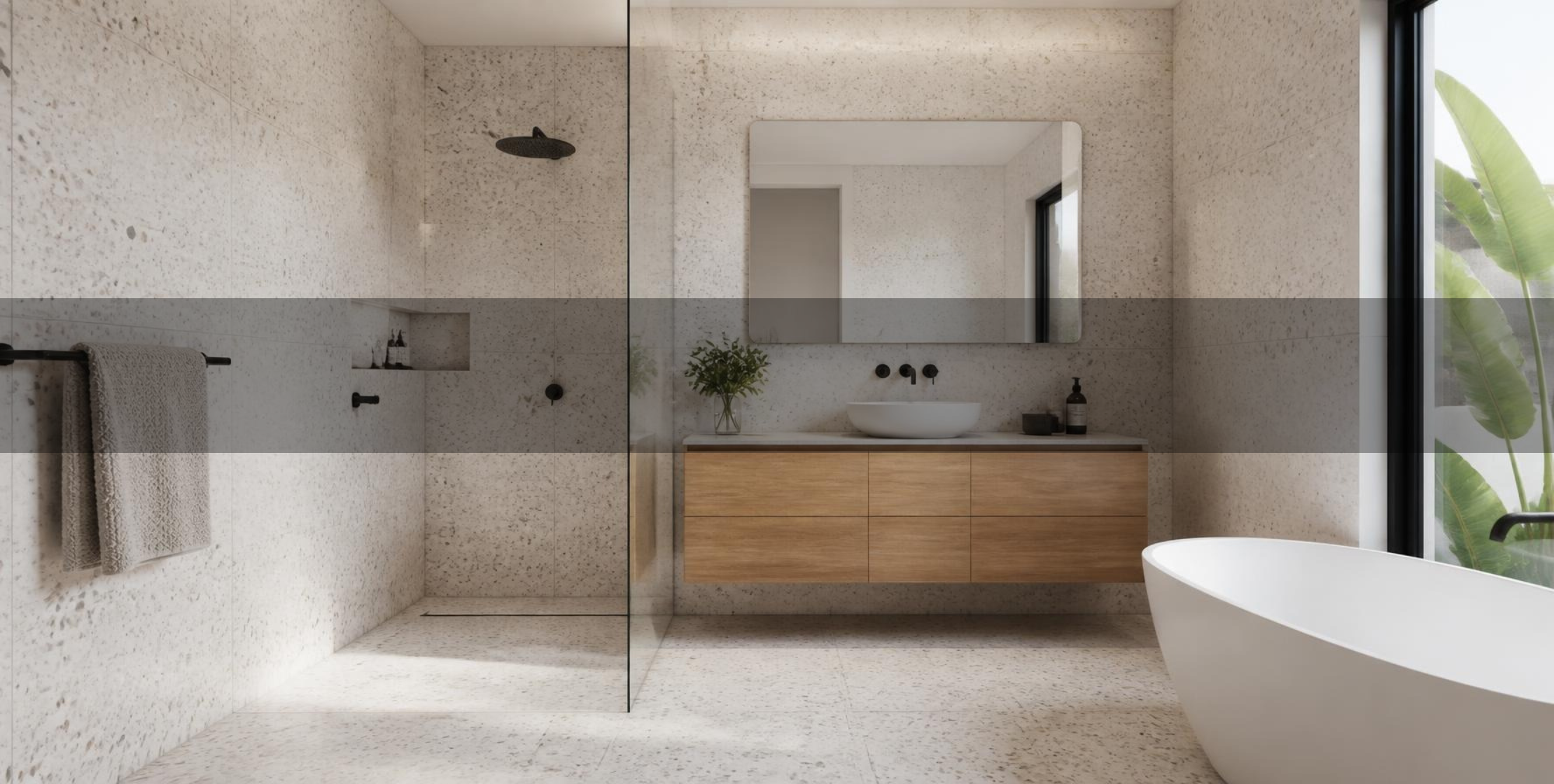 Modern Adelaide bathroom with white terrazzo-look porcelain tile floor and walls, walk-in shower and freestanding tub